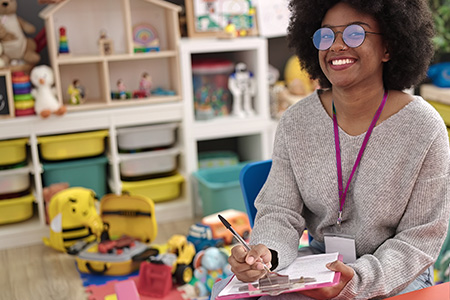 Student taking notes in a nursery